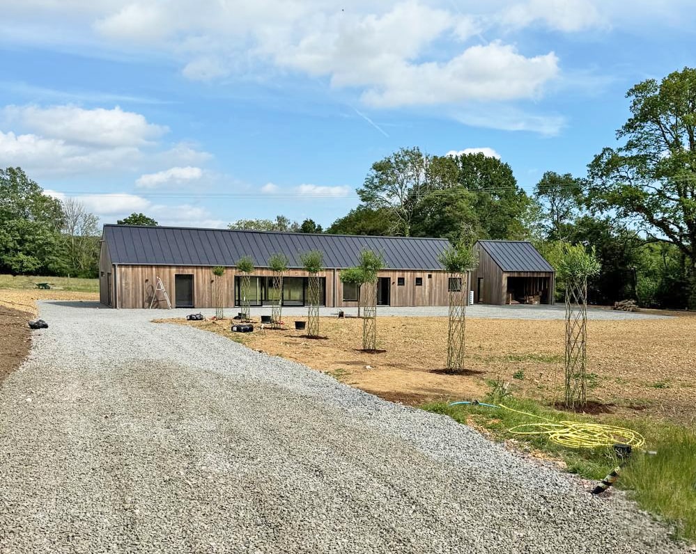Day picture of alley of living willow sculptures